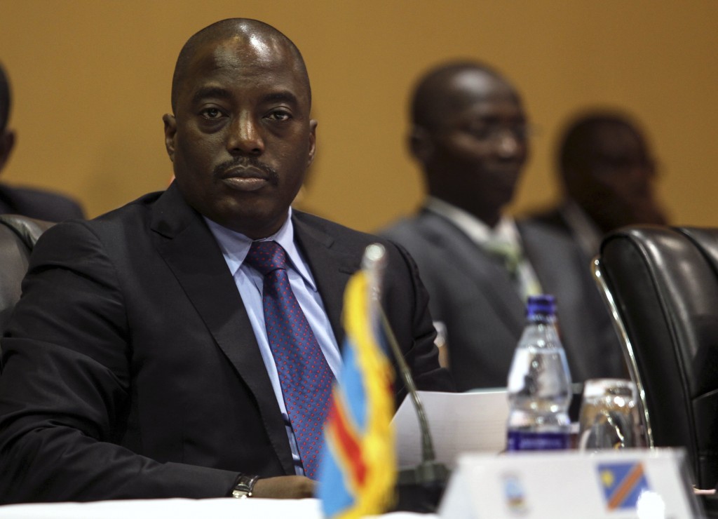 Democratic Republic of Congo's President Kabila listens to deliberations in Kampala