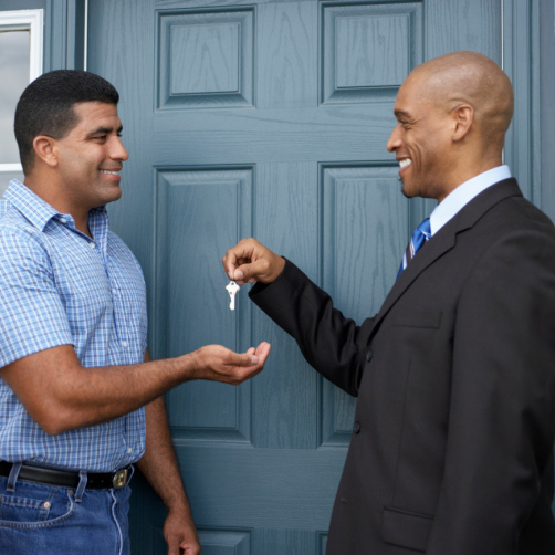 Salesman Handing Man House Keys