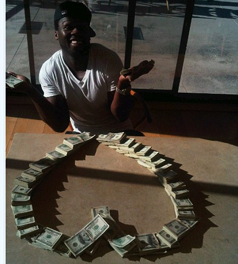 50 Cent flaunts stacks of cash - a half-million dollars - as if they were Lego bricks in Twitter. The rapper posted the series of pictures saying that he was headed to Las Vegas and intended on doubling his $500,000 stake. After building a house with the cash he pretended to eat it and then rearranged the stacks into a heart. He Tweeted: "Who said I don't have a heart. Lol." Ref: SPL224126 041110 Picture by: Splash News / Twitter Splash News and Pictures Los Angeles: 310-821-2666 New York: 212-619-2666 London: 870-934-2666 photodesk@splashnews.com 