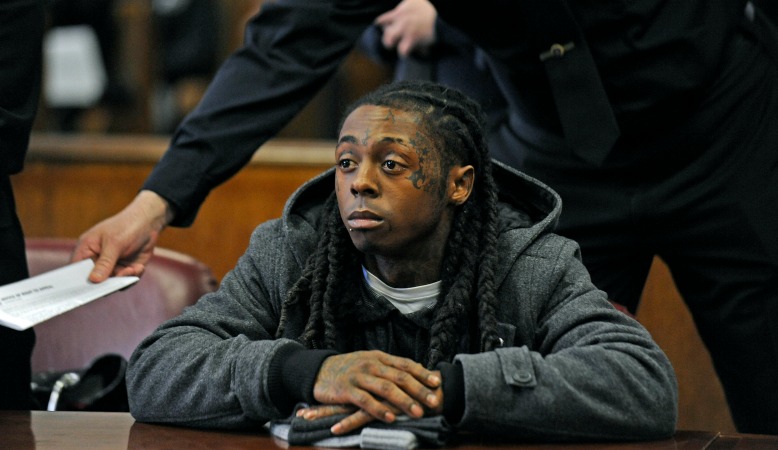Lil Wayne is sent to jail for one year on a gun charge.